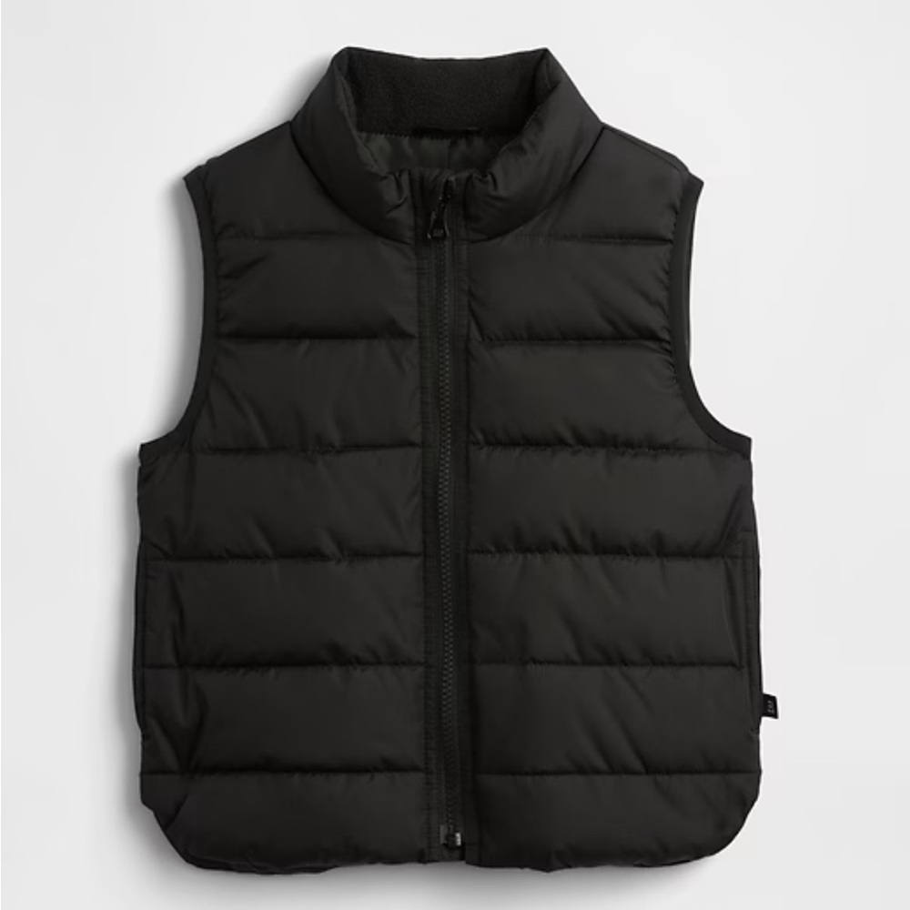 Brand new, in the package black puffer vest